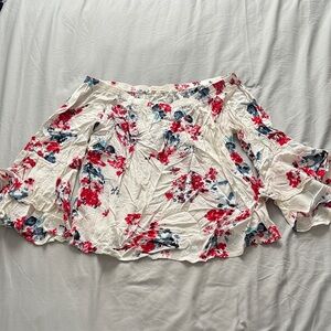 White shirt with floral bell sleeves. Shoulder-less.